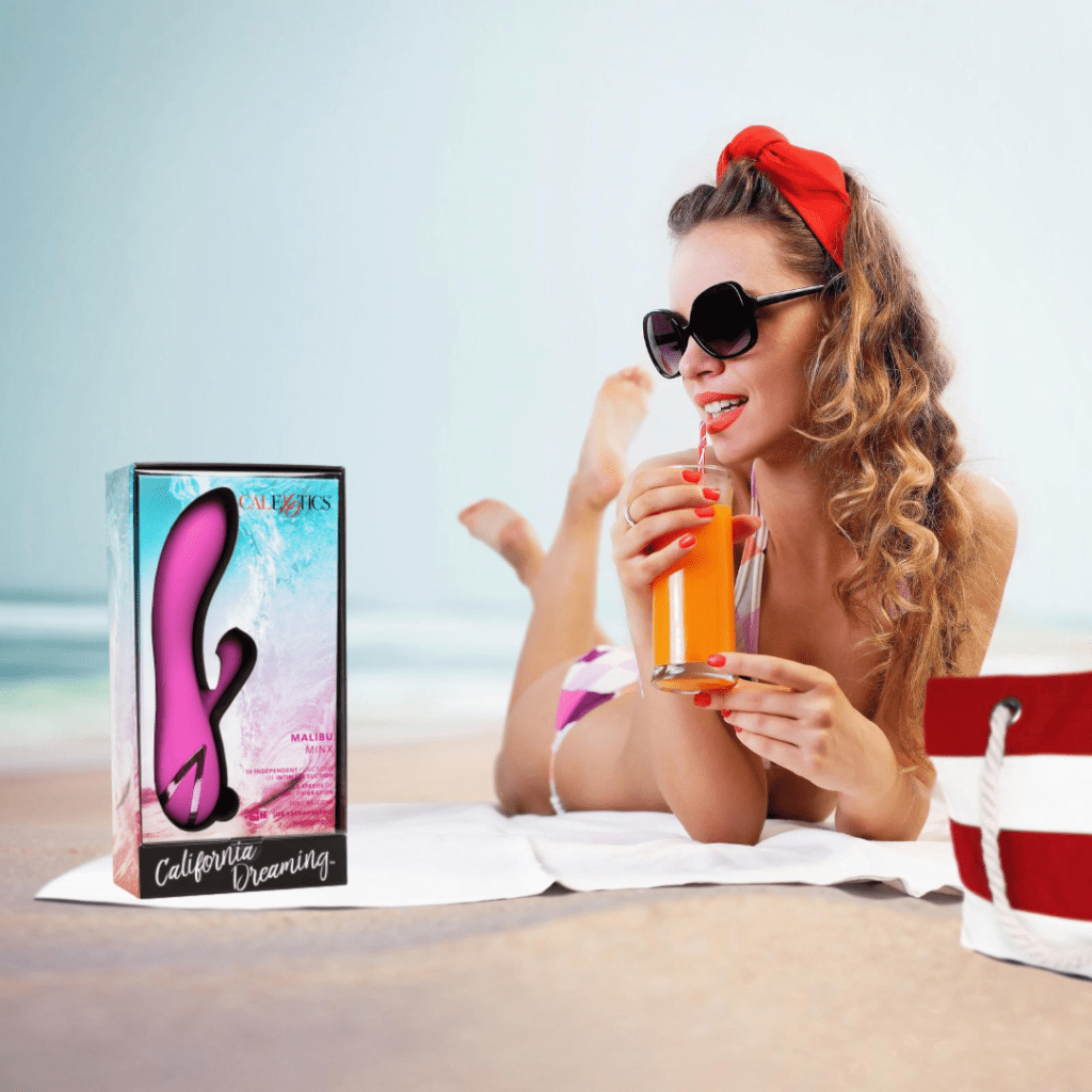 Girl on the beach with a vibrator